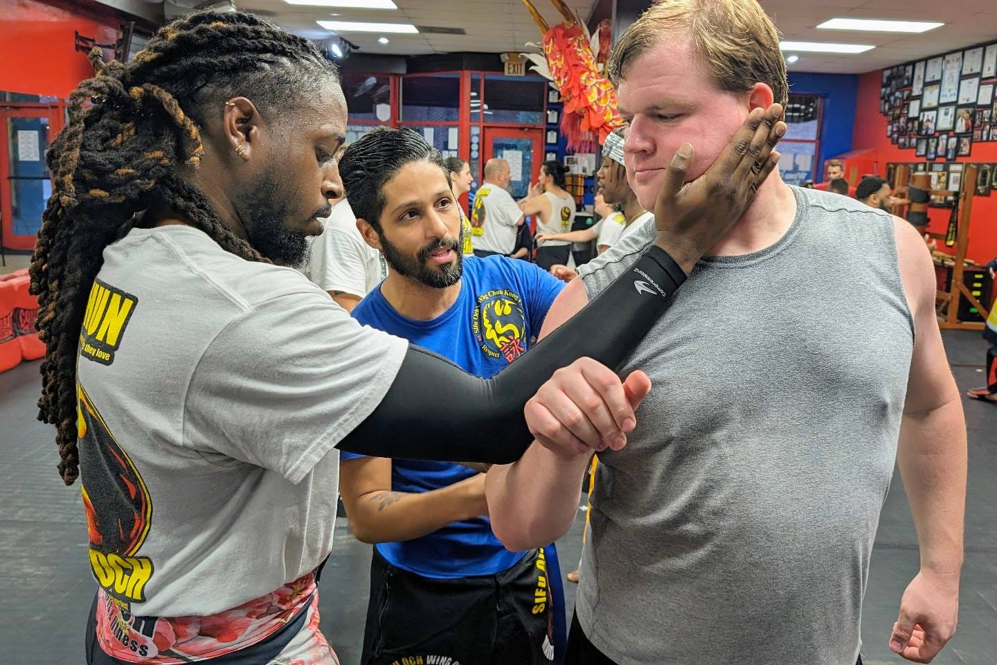 wing chun student practicing a palm technqiue in group martial arts classes