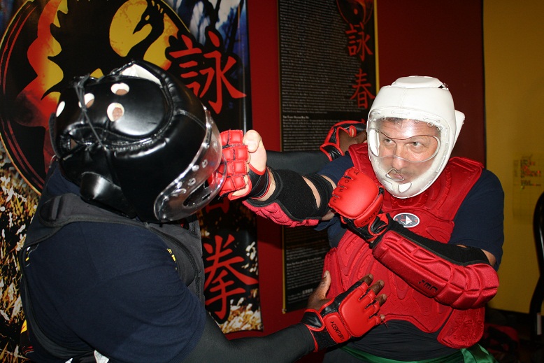 advanced wing chun martial arts students training in sparring session
