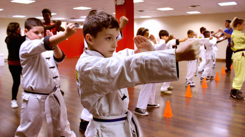 kid looking focused punching forward using wing chun technique